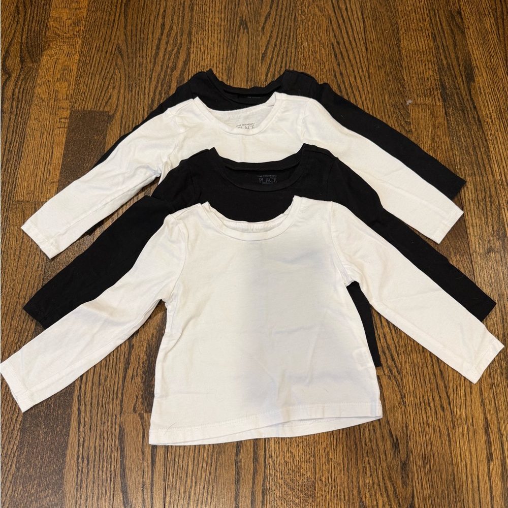 Four Long Sleeved The Children’s Place Shirts in Solid Black and White 12-18 Mos